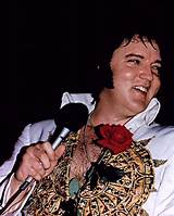 A King's Adornment: Elvis in His Iconic Tcb Necklace